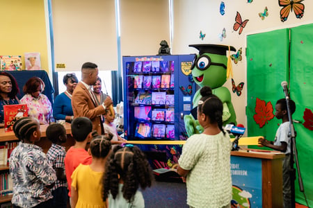 A school ribbon cutting for a new book vending machine