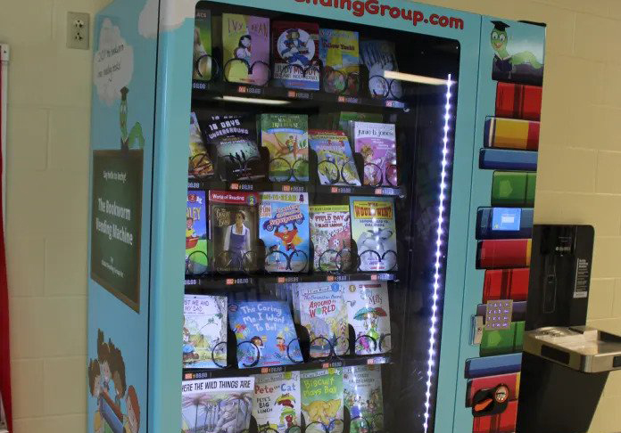Excited to read Olive Hill vending machine rewards students with books
