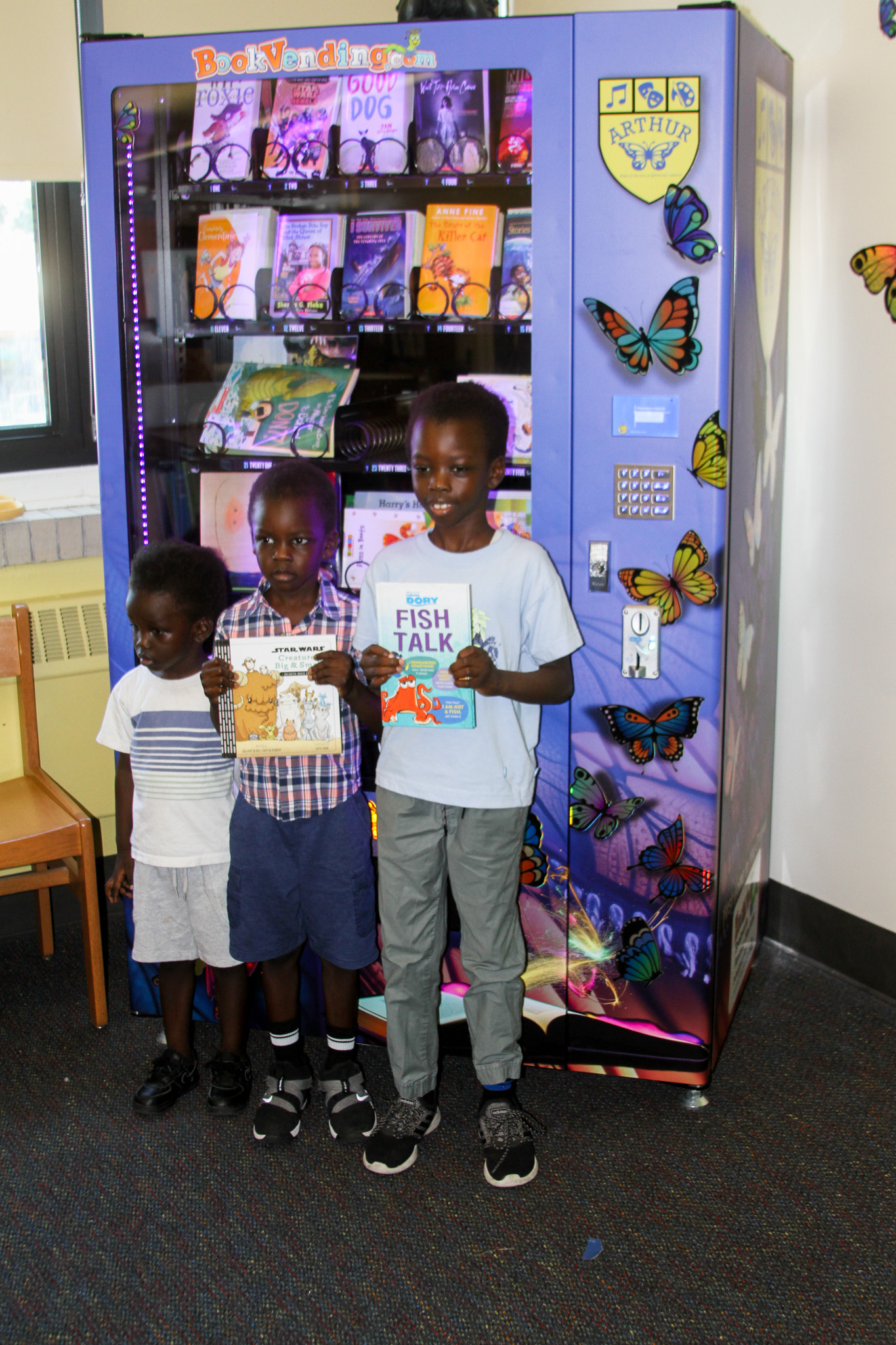 Students recieve first books from updated Inchy's Bookworm Vending Machine