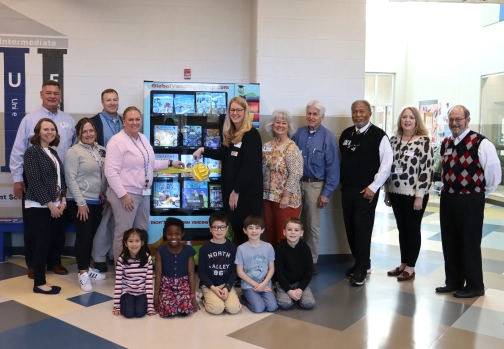 Hogsett and Toliver receive book vending machines